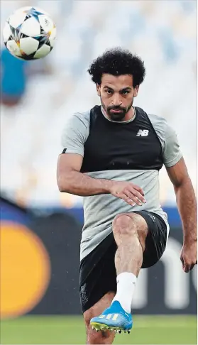  ?? MATTHIAS SCHRADER THE ASSOCIATED PRESS ?? Liverpool's Mohamed Salah poses a serious threat to the decade of dominance of the world player of the year award by Ronaldo and Barcelona’s Lionel Messi.