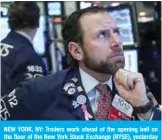  ??  ?? NEW YORK, NY: Traders work ahead of the opening bell on the floor of the New York Stock Exchange (NYSE), yesterday in New York City.— AFP