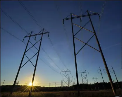  ?? ROBERT F. BUKATY) (ROBERT F. BUKATY/AP — THE ASSOCIATED PRESS ?? Central Maine Power utility lines, Oct. 6, 2021, in Pownal, Maine.