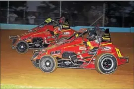  ??  ?? Father and son, Tom and TJ Mayberry, duel for position at Action Track USA in Kutztown.