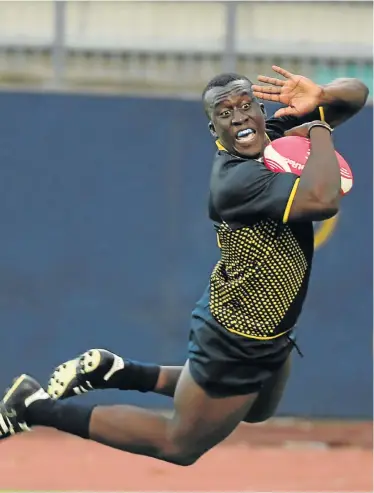  ?? Picture: FREDLIN ADRIAAN ?? FLYING OVER: FNB Madibaz wing Charles Radebe goes over the tryline in spectacula­r style in a game against the Cape Peninsula University of Technology at the Madibaz Stadium in Port Elizabeth on Monday