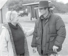  ??  ?? Yannick Bisson, who plays Det. William Murdoch, greets fan Bev Anderson.