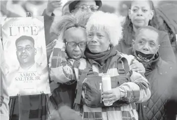  ?? SCOTT OLSON/GETTY ?? People attend a vigil Tuesday in Buffalo, N.Y., to remember 10 Black people killed last week at a market.