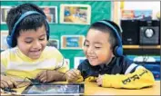  ?? Christina House
For The Times ?? PRESCHOOL STUDENTS Angel Chinol Gonzalez, left, and Alexander Manuel Cano in a preschool program that is being studied for cutbacks.