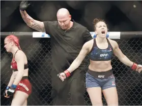  ??  ?? WINNER. Maycee Barber (right) reacts after defeating Gillian Robertson in their women’s flyweight mixed martial arts bout in Boston.