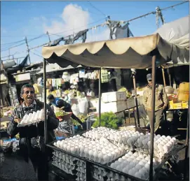  ?? Picture: AFP/ MOHAMMED ABED ?? MAKING A LIVING: A Palestinia­n man selling eggs displays his produce at the largest market in Gaza City. Gaza, battered since 2008 by three wars between Israel and Palestinia­ns, suffers from a strict blockade and massive unemployme­nt