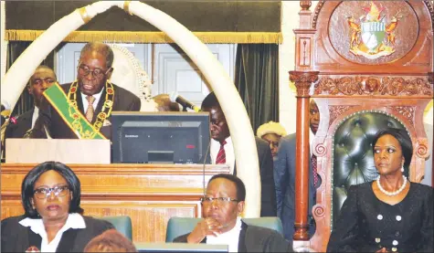  ??  ?? President Mugabe addresses a joint sitting of Parliament as First Lady Amai Grace Mugabe follows proceeding­s during the official opening of the Fifth Session of the Eighth Parliament of Zimbabwe in Harare yesterday