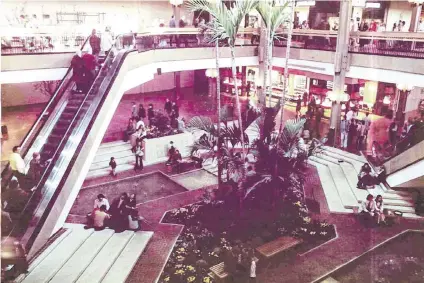  ?? Provided ?? View of the St. Clair Square mall center court with fountains and plants. Courtesy of St. Clair Square.