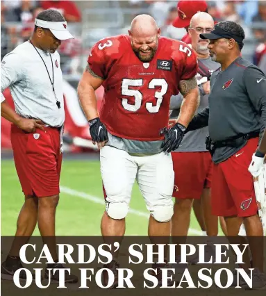  ?? PHOTOS BY ROB SCHUMACHER/THE REPUBLIC ?? Cardinals center A.Q. Shipley grimaces after suffering a torn ACL during the annual Red and White Practice on Saturday at University of Phoenix Stadium in Glendale.