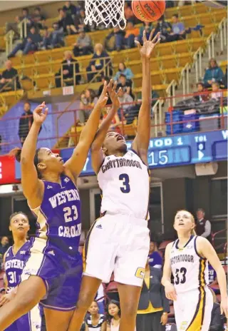  ?? UTC PHOTO BY DALE RUTEMEYER ?? Jasmine Joyner (3) scored 14 points and grabbed nine rebounds during the Mocs’ 85-41 win over Western Carolina in the first round of the SoCon tournament Thursday.