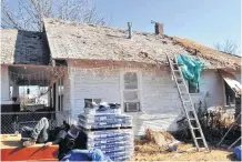  ??  ?? Before: A home in the Classen-Ten-Penn neighborho­od before volunteers with Rebuilding Together OKC installed a new roof last year.