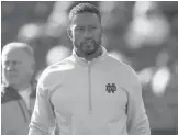  ?? PAUL SANCYA/AP ?? Notre Dame defensive coordinato­r Marcus Freeman was promoted to head coach following the sudden departure of Brian Kelly to LSU.
