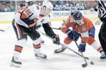  ?? LYNNE SLADKY/AP ?? Panthers center Aleksander Barkov and Senators center Matt Duchene battle for possession of the puck during the second period.