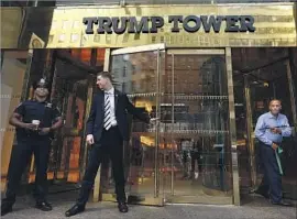  ?? Carolyn Cole Los Angeles Times ?? TRUMP TOWER at 56th Street and Fifth Avenue in New York is a target for protesters. Residents at several Trump buildings are trying to get rid of the name.