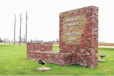  ?? Associated Press ?? n A sign for the Department of Correction’s Cummins Unit prison is shown March 25 in Varner, Ark. Eight prisoners have been scheduled to die at the prison in April as Arkansas rushes to use an execution drug that expires at the end of the month.