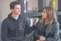  ?? Michael Ciaglo, Getty Images ?? STEM School Highlands Ranch senior Brendan Bialy comforts his mother, Dena Martin, as he speaks to the media on May 8 in Englewood.