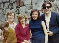  ??  ?? Family love: left, Janet and Paul at the Belfast Telegraph Sports Awards. Above, Janet (centre) with her brother Ian, granny Snowdon, and her mother Maureen and father John on the Isle of Man in 1972. Below: Janet as a young girl