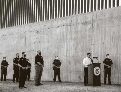  ?? Sergio Flores / New York Times ?? ChadWolf, acting secretary of Homeland Security, speaks near a border wall constructi­on site outside McAllen on Oct. 29. His department has been racing to deliver on President Donald Trump’s promise of 450 miles of wall before 2021.