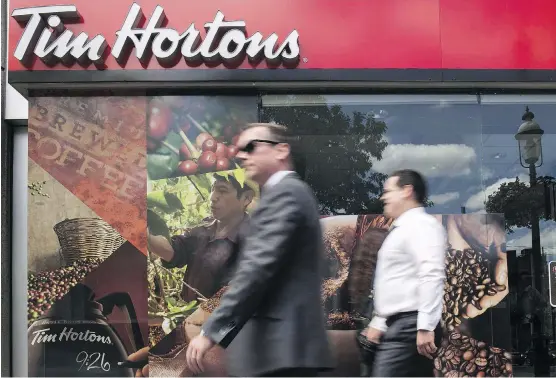  ?? EDUARDO LIMA/THE CANADIAN PRESS ?? Brand Finance finds the value of Tim Hortons rose by 16.6 per cent to $6.3 billion over the past year, despite bad PR from a feud with franchisee­s.