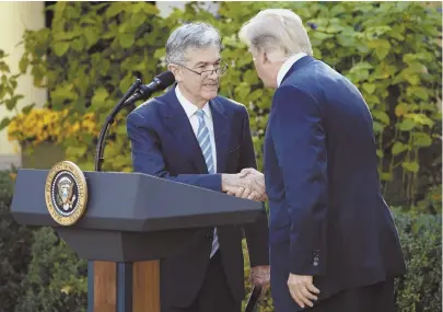  ?? AP PHOTO ?? LATEST NOMINEE: President Trump shakes hands with Federal Reserve board member Jerome Powell.