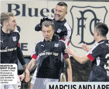  ??  ?? HEARTS IN RIGHT PLACE Dundee’s Paul McGowan is mobbed after late leveller in 3-2 win over Jambos