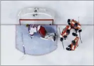  ?? MATT SLOCUM — THE ASSOCIATED PRESS ?? Flyers right wing Jakub Voracek (93), center Sean Couturier (14) and defenseman Michael Del Zotto (15) celebrate after Voracek’s game-winning goal beat New York Rangers goalie Mackenzie Skapski (70) in overtime Monday in Philadelph­ia.