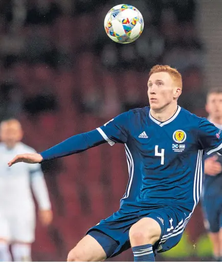  ?? Picture: SNS. ?? Scotland defender David Bates, left, holds off Israel’s Eran Zahavi.