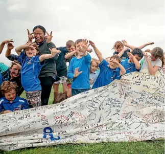  ?? PHOTO: DAVID JAMES/STUFF ?? Wairau Valley School children dabbing for their sailing idols after they wrote their messages of support on a sail for Team New Zealand.