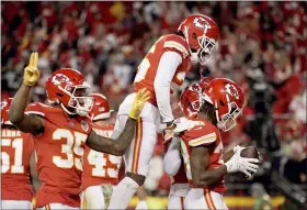 ?? CHARLIE RIEDEL - THE ASSOCIATED PRESS ?? Kansas City Chiefs cornerback L’Jarius Sneed, right, celebrates with teammates after catching an intercepti­on late in the second half of an NFL football game against the Dallas Cowboys, Sunday, Nov. 21, 2021, in Kansas City, Mo. The Chiefs won 19-9.