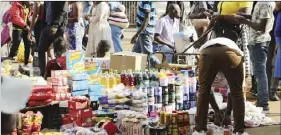  ?? ?? Vendors selling groceries on the streets in Harare. Picture: Hilary Maradzika