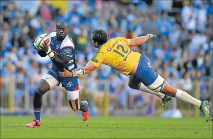  ?? Picture: ASHLEY VLOTMAN/GALLO IMAGES ?? FULL TILT: Raymond Rhule, of the Stormers, left, tries to evade Bulls captain and centre Burger Odendaal during their Super Rugby match at Newlands in Cape Town on Saturday