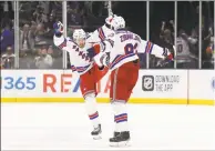  ?? Bruce Bennett / Getty Images ?? The Rangers’ Artemi Panarin, left, and Mika Zibanejad celebrate their 4-3 victory over the Islanders in February.