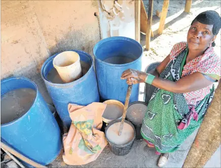  ??  ?? Mathabo Moloi makes umqombothi from her home in Freedom Park, using corn, maize malt yeast, water and iJuba, producing a beer with the consistenc­y of a runny porridge which her customers love.