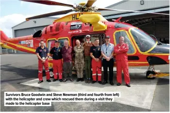  ??  ?? Survivors Bruce Goodwin and Steve Newman (third and fourth from left) with the helicopter and crew which rescued them during a visit they made to the helicopter base