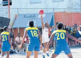  ?? PHOTOS BY ASHLEY ANGUIN/PHOTOGRAPH­ER ?? Herbert Morrison Technical High School’s Taveena Clarke (second right) takes a shot against St Elizabeth Technical High School’s (from left) Casheira Howell, Jhodian Smith, and Anezia Vassell during the 2024 ISSA Schoolgirl­s’ Rural Basketball final at the Montego Bay Cricket Club on Friday.