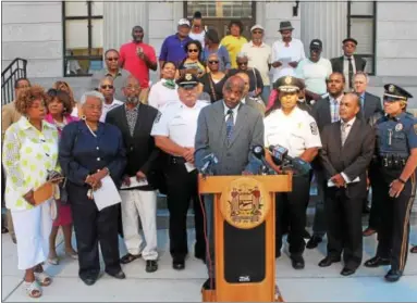  ?? OSCAR GAMBLE DIGITAL FIRST MEDIA ?? Greater Norristown NAACP President John Milligan, backed by Montgomery County law enforcemen­t officials and NAACP leadership, addresses the media Monday at the Montgomery County Court House in Norristown during a news conference announcing an...