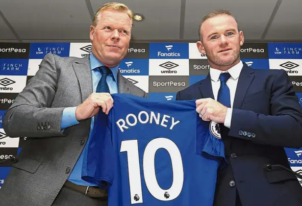  ?? — AP ?? Homecoming: Everton manager Ronald Koeman presenting the No. 10 jersey to Wayne Rooney at Goodison Park on Monday.