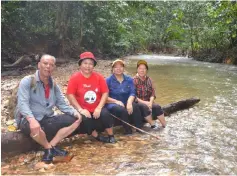  ??  ?? Some of the trip participan­ts take a breather before continuing their journey to the Sungai Sebatu Tagang system.