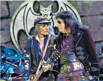  ??  ?? Shy: Johnny Depp was coaxed to the fore by Alice Cooper at Wembley