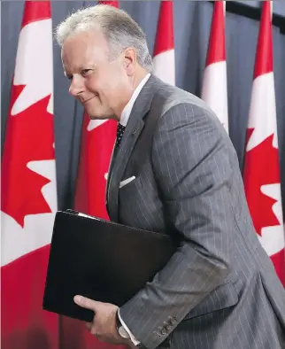  ?? FRED CHARTRAND/THE CANADIAN PRESS ?? Bank of Canada governor Stephen Poloz says a surprising­ly stronger economy led to the bank’s first rate increase since September 2010. “The economy can handle very well this move.”