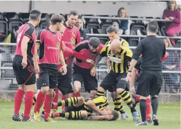  ??  ?? Tempers flared when Holbeach (stripes) ended the unbeaten UCL Premier Division run of Sileby last weekend.