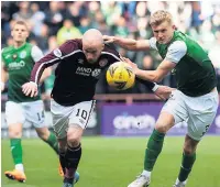  ?? ?? OLDER AND WISER Josh Doig, right, sees off Liam Boyce