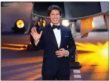  ?? (AP Photo/Alberto Pezzali) ?? Tom Cruise poses for the media during the “Top Gun: Maverick” UK premiere at a central London cinema on May 19. The film remained at No. 1 with $86 million in ticket sales.