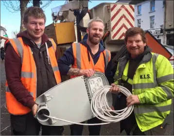  ??  ?? Jack Cleere, Emmet Costigan and Derek Wemyss of Killaree Lighting Service, pictured installing the new LED lights on Gorey’s Main Street. Below: one of the new lights.