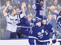  ?? FRANK GUNN THE CANADIAN PRESS ?? Mitch Marner celebrates his goal with Maple Leafs teammate Nikita Zaitsev on Thursday afternoon at Scotiabank Arena.