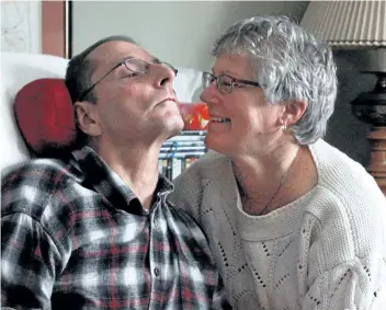  ?? LAURA BARTON/ WELLAND TRIBUNE ?? Karen Gillespie smiles lovingly at her husband Jack in their Welland home. The couple are subjects of a CBC documentar­y called The Caregivers’ Club, which gave Karen the opportunit­y to share her story as a caregiver for her husband, who has early-...