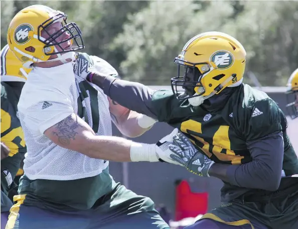  ?? TRENT SCHNEIDER/EDMONTON ESKIMOS ?? Defensive end Alex Bazzie, right, takes on offensive tackle Colin Kelly during mini-camp drills Monday in Las Vegas. The Eskimos used their mini-camp in Las Vegas to install new offensive and defensive schemes and get the full roster of 72 players up...