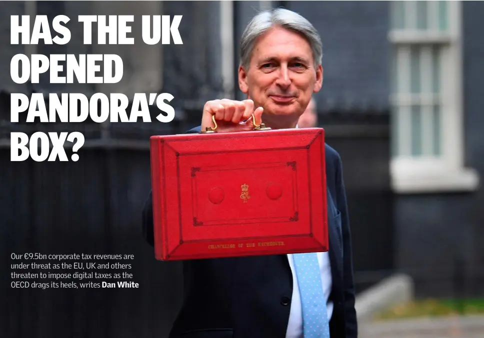  ?? Photo: Stefan Rousseau/PA ?? UK chancellor of the exchequer Philip Hammond holding his red ministeria­l box outside 11 Downing Street, London last Monday, before delivering his budget speech.