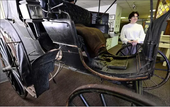  ?? JENNY SPARKS — LOVELAND REPORTER-HERALD ?? Lindsay Nilles, the new director of the Little Thompson Valley Pioneer Museum, stands near an antique carriage Friday at the museum in Berthoud.