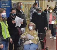  ?? MEDIANEWS GROUP FILE PHOTO ?? Delaware County residents line up for their first Moderna vaccine shot at a clinic at Upper Darby High School on March 14.